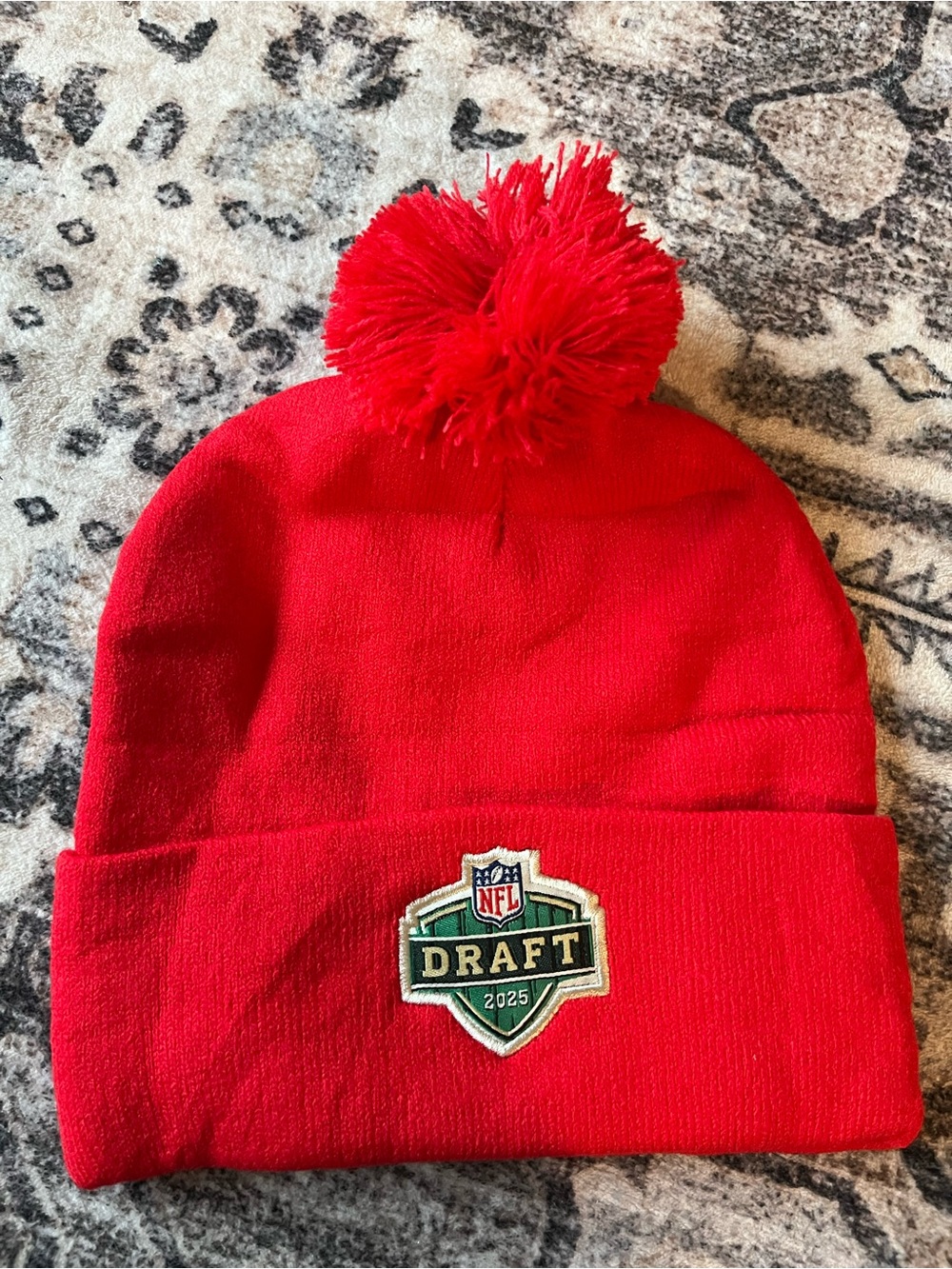 NFL Green Draft Patch Beanie on Red Knit